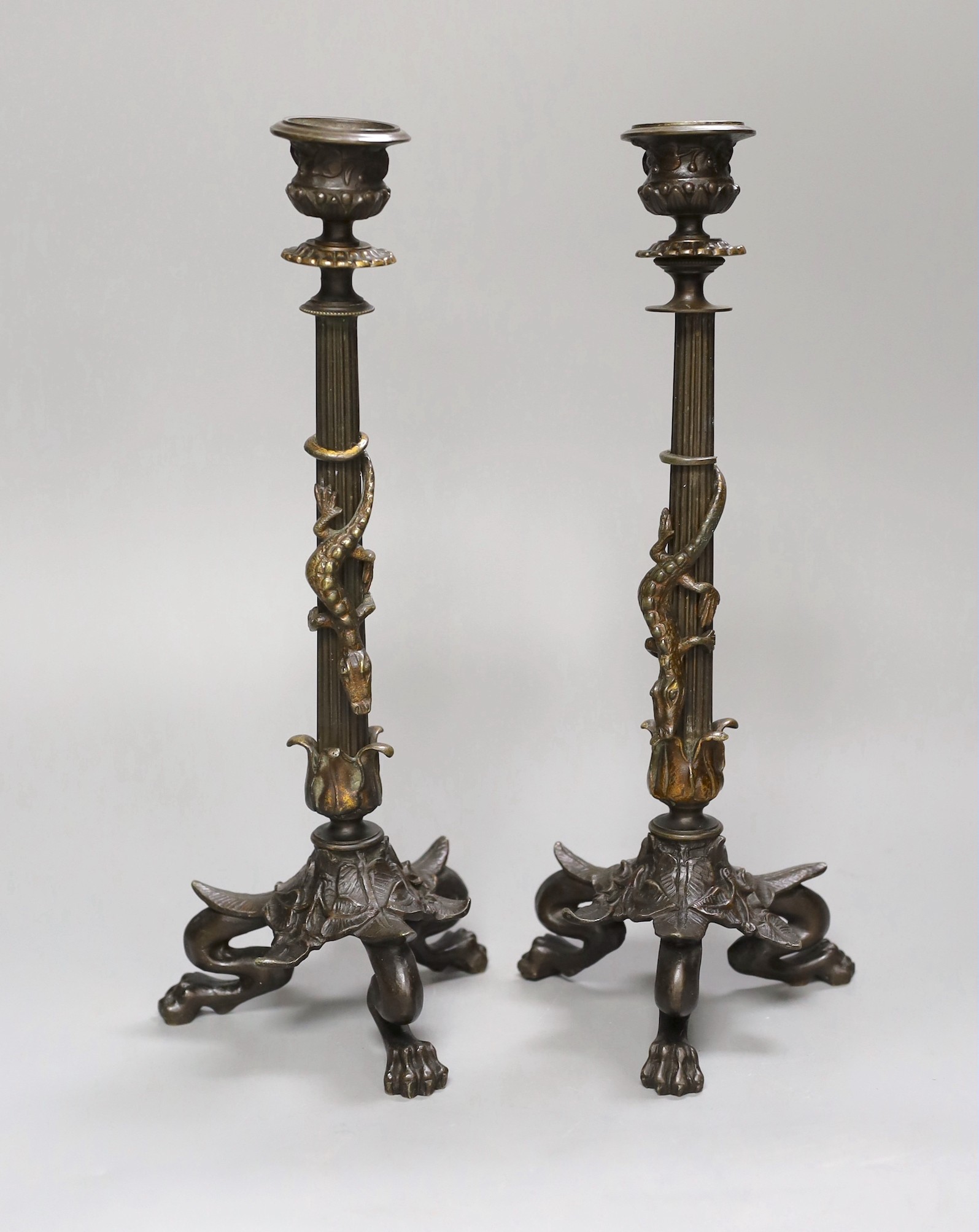 A pair of bronze empire style ‘lizard’ candlesticks, 30cm